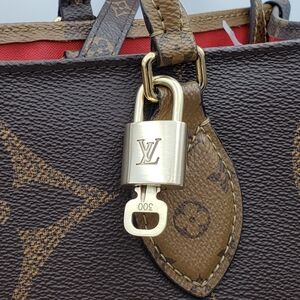 Authentic Louis Vuitton Gold Padlock In Excellent Shiny Brass 011426